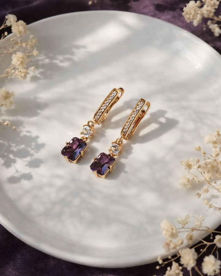 auskari apzeltīti ar lillā kristālu