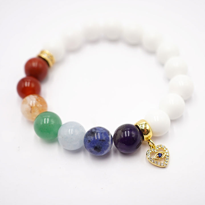 Rokassprādze 7 čakras ar balto shštu psmsts un zelta krāsas piekariņu sirds formā