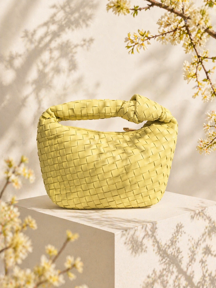 Eleganta sieviešu knot handle soma kompaktā izmērā ar minimālistisku dizainu